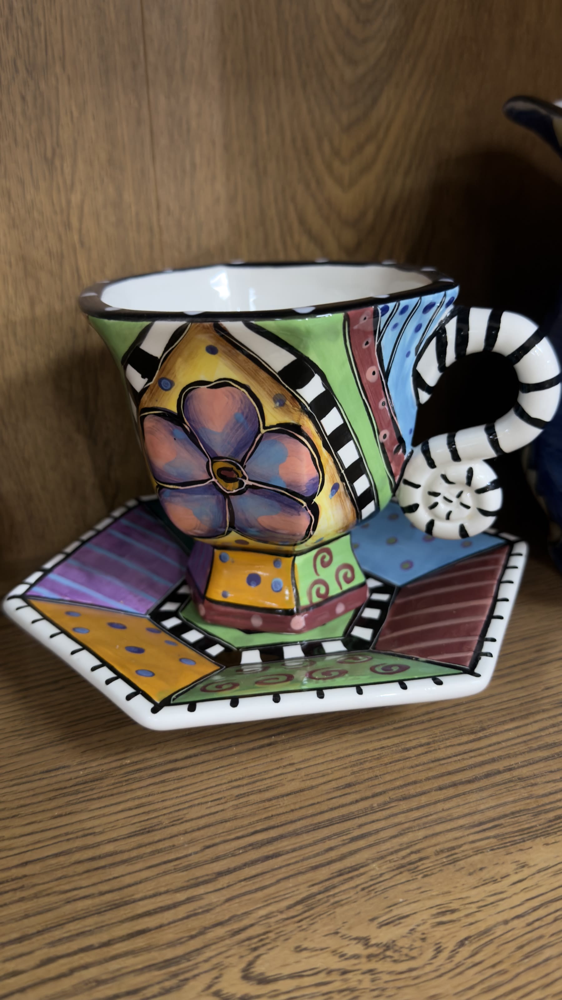 Hand-painted patchwork ceramic teacup and saucer